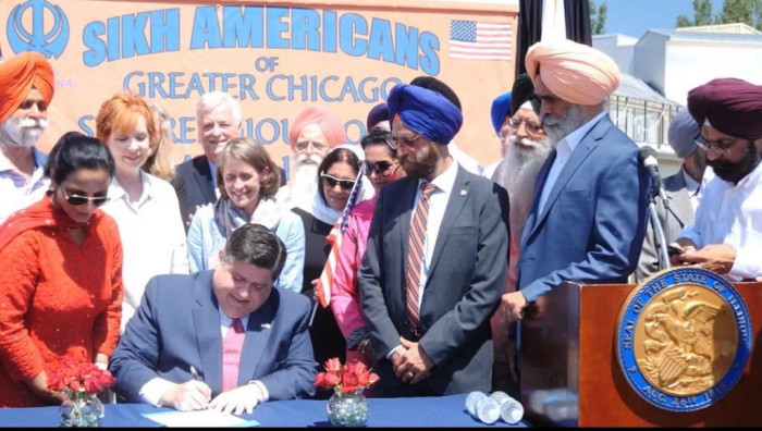 Sikh Awareness and Appreciation Month of April_Bill HB2832 Signing_3 Aug 2019_Illinois Governor J B Pritzker signing the bill at Palatine gurdwara_1.jpg
