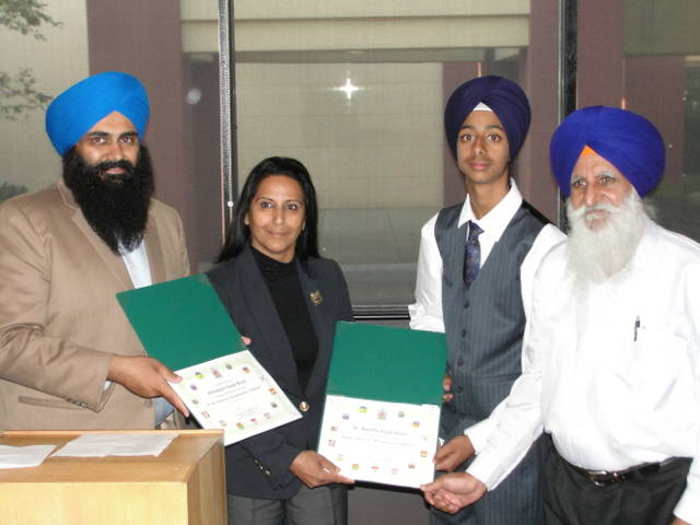 Tim Uppal and Grewal Honouring Bikram and Dr Bains with Appreciation Certificate (133K)