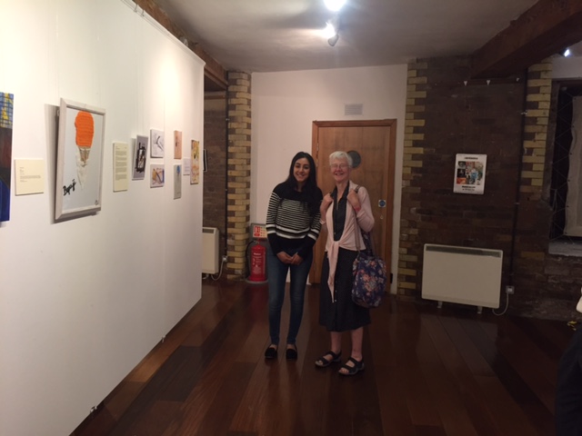 Artist%20Kiminder%20Kaur%20with%20an%20exhibition%20attendee (44K)
