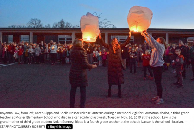 Khalsa remembrance lamps lit.png