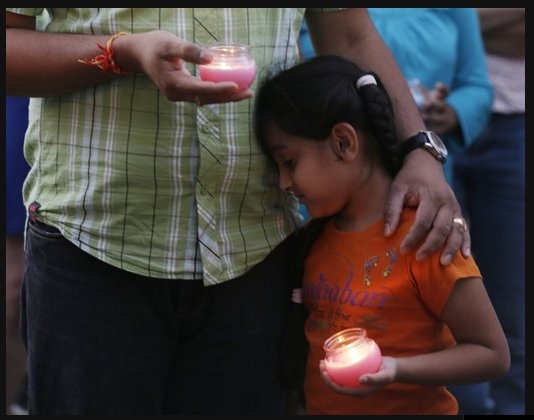 ManHoldsHisChild (135K)