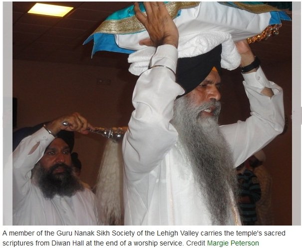 CarryingSacredScripture (93K)