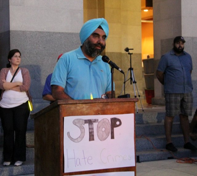 DR-Kang-speaking-at-the-Wisconson-Sikh-Temple-Vigil-at-State-Capitol-on-Aug-10-2012 (218K)