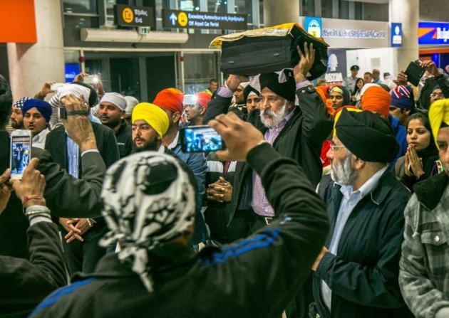 HoldingTheSacredGranth (144K)