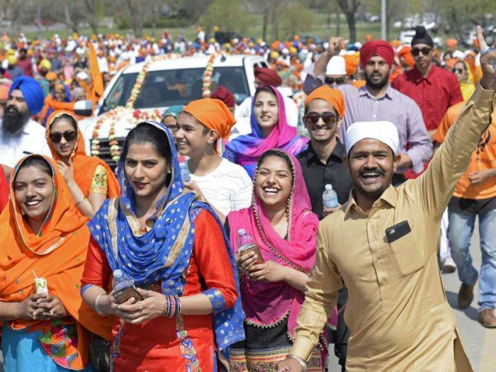 a-man-smiles-and-waves-during-a-sikh-day-parade-in-regina-s1 (126K)