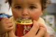 Baby drinking a Coke